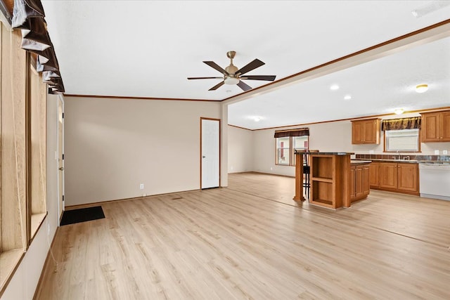 kitchen featuring dishwasher, ornamental molding, ceiling fan, sink, and light hardwood / wood-style flooring