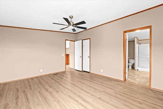 unfurnished bedroom with ceiling fan, light hardwood / wood-style flooring, ornamental molding, and ensuite bath