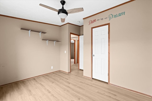 unfurnished bedroom featuring ceiling fan, light hardwood / wood-style floors, and ornamental molding