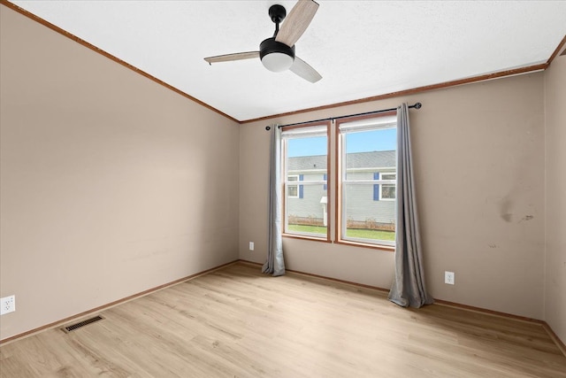 spare room featuring ceiling fan and light hardwood / wood-style flooring