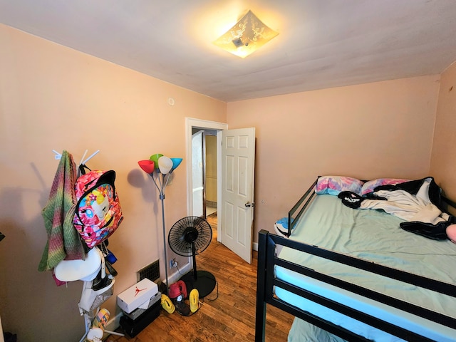 bedroom featuring hardwood / wood-style floors