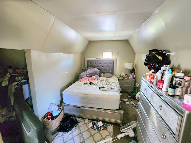 bedroom featuring lofted ceiling