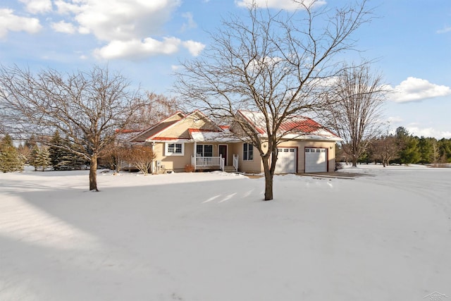 view of front of property with a garage and covered porch