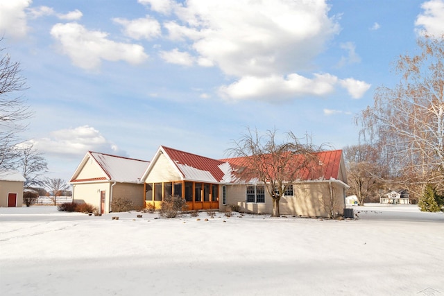 view of front of property featuring a sunroom