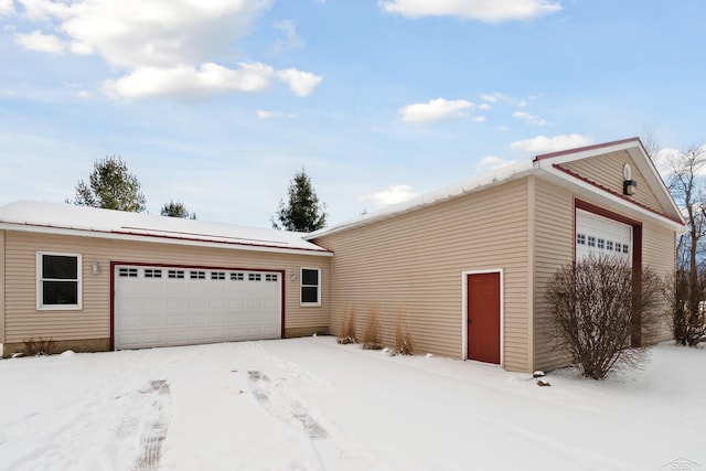 view of snow covered garage