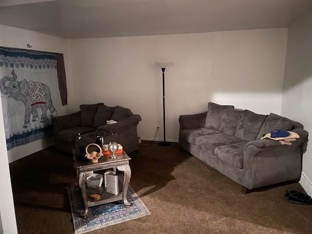 living room featuring dark colored carpet