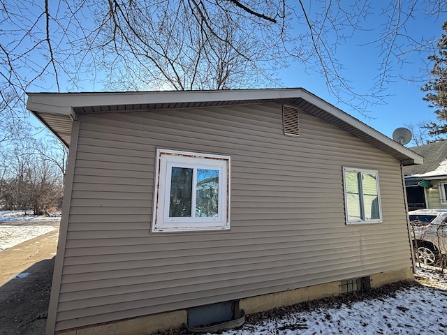 view of snow covered property