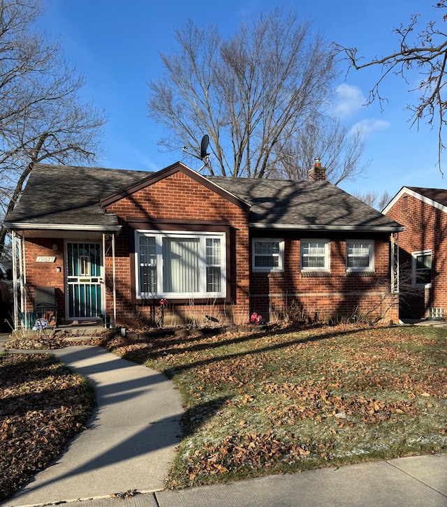 ranch-style home with a front yard