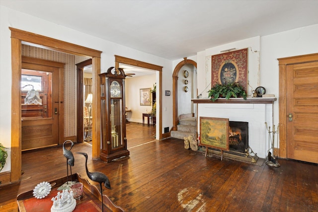 living room with dark hardwood / wood-style flooring