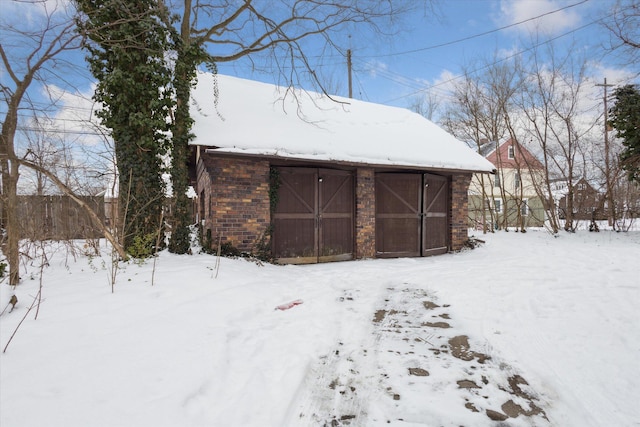 view of snow covered garage