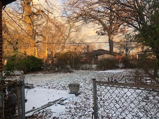 view of yard layered in snow