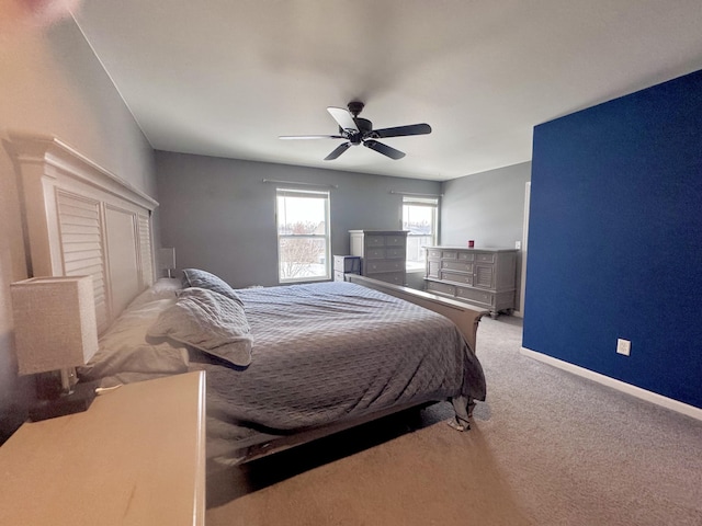 bedroom with ceiling fan and light colored carpet