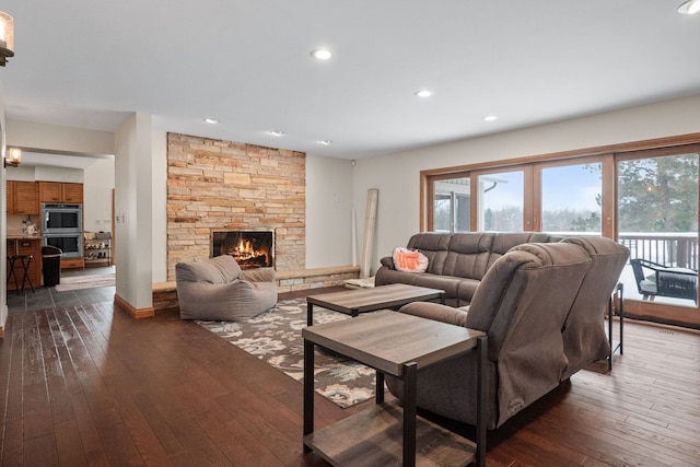 living room featuring dark hardwood / wood-style floors and a fireplace