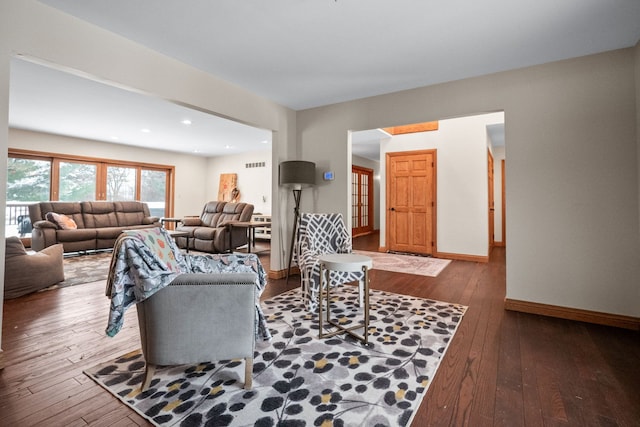 living room with dark hardwood / wood-style floors