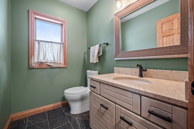 bathroom with toilet and vanity