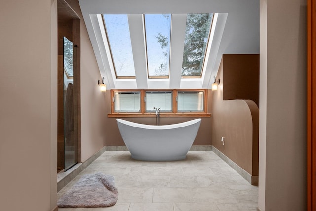 bathroom featuring a skylight and shower with separate bathtub