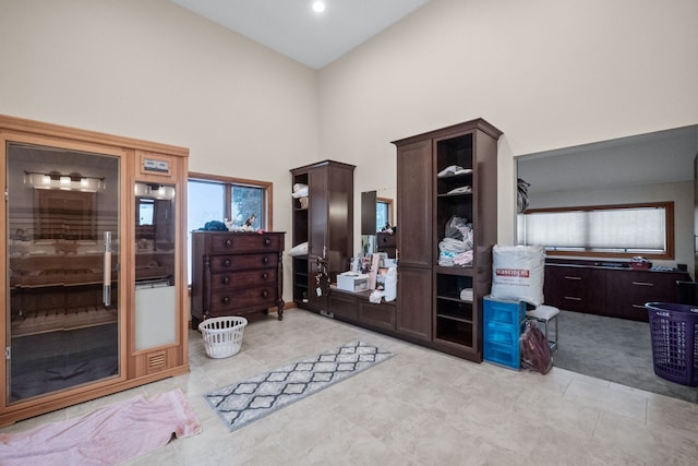 tiled bedroom with high vaulted ceiling