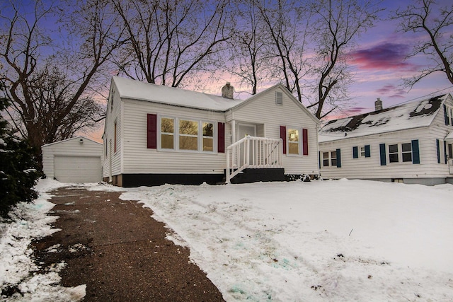 view of front of property featuring an outbuilding and a garage