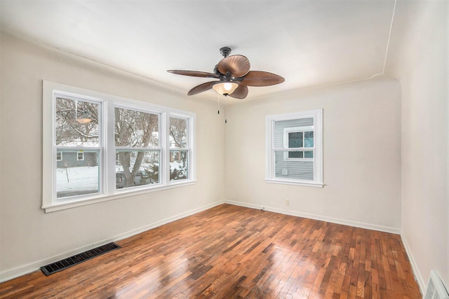 unfurnished room featuring ceiling fan and dark hardwood / wood-style floors