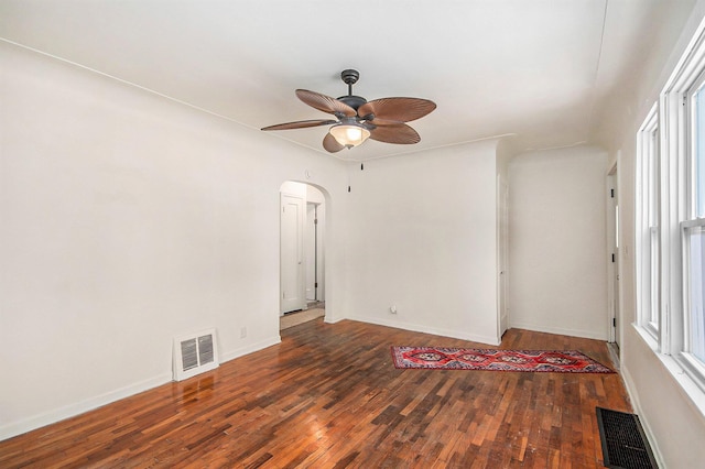 unfurnished room featuring ceiling fan and dark hardwood / wood-style floors