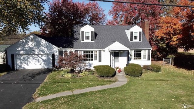 cape cod-style house with a garage and a front lawn