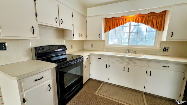 kitchen featuring sink, white cabinetry, black electric range, and tasteful backsplash