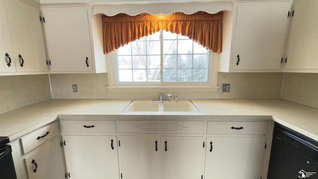 kitchen featuring sink, decorative backsplash, white cabinetry, and dishwasher