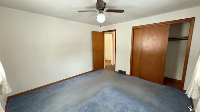 unfurnished bedroom with carpet floors, ceiling fan, and a closet