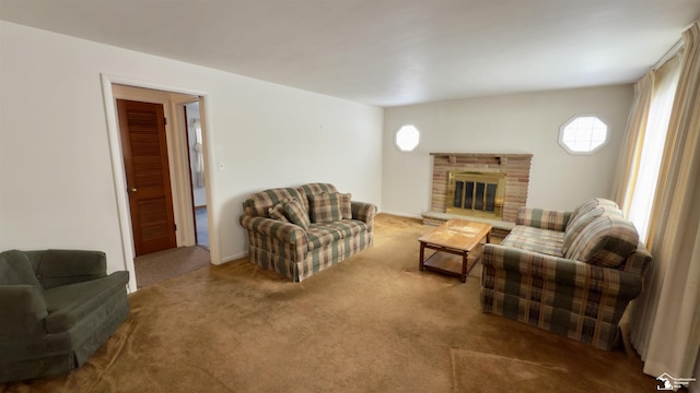 living room with a brick fireplace and carpet flooring