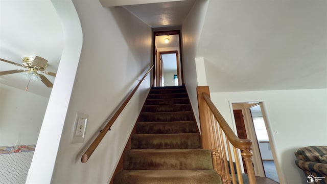 stairs with ceiling fan