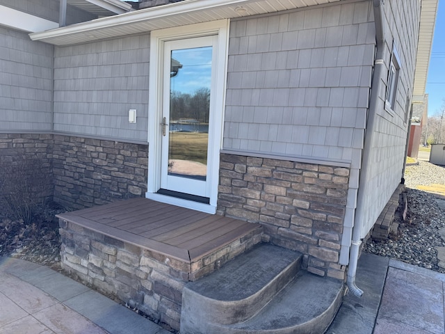 view of exterior entry with stone siding