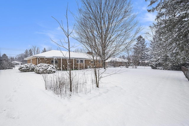 view of yard layered in snow