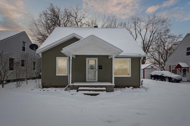 view of front of home featuring an outbuilding and a garage