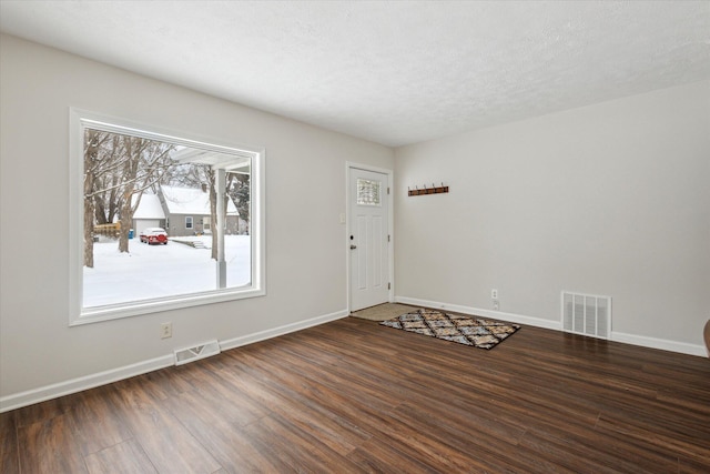 unfurnished room with dark hardwood / wood-style floors