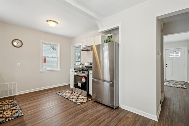 kitchen featuring dark hardwood / wood-style flooring, white cabinetry, and appliances with stainless steel finishes