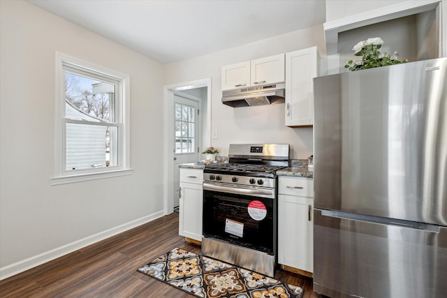 kitchen featuring stone counters, appliances with stainless steel finishes, dark hardwood / wood-style flooring, and white cabinetry