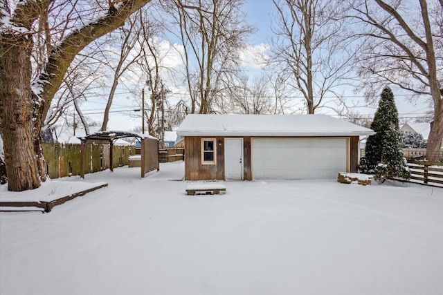 view of front of home featuring a garage and an outdoor structure