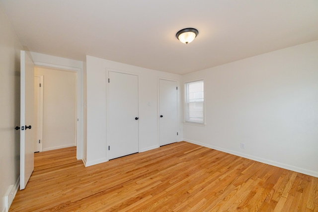 unfurnished bedroom with light hardwood / wood-style floors