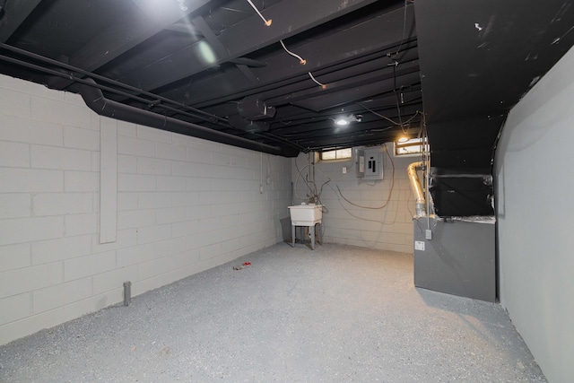 basement with sink and electric panel