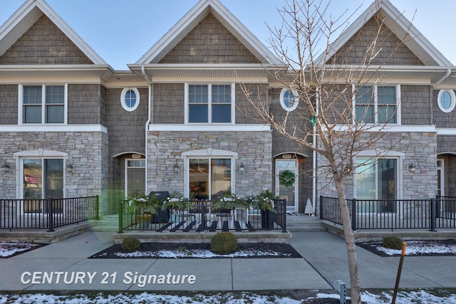 townhome / multi-family property with covered porch