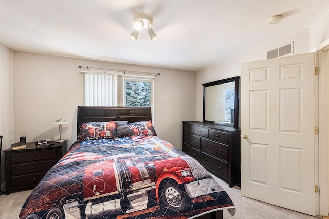 bedroom with light colored carpet