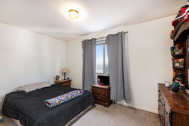 bedroom with light colored carpet