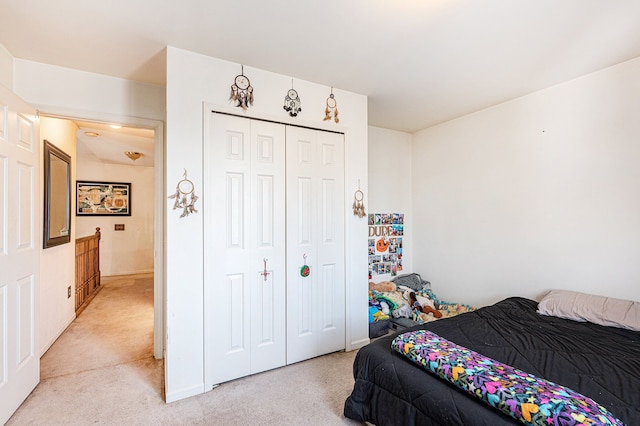 carpeted bedroom with a closet