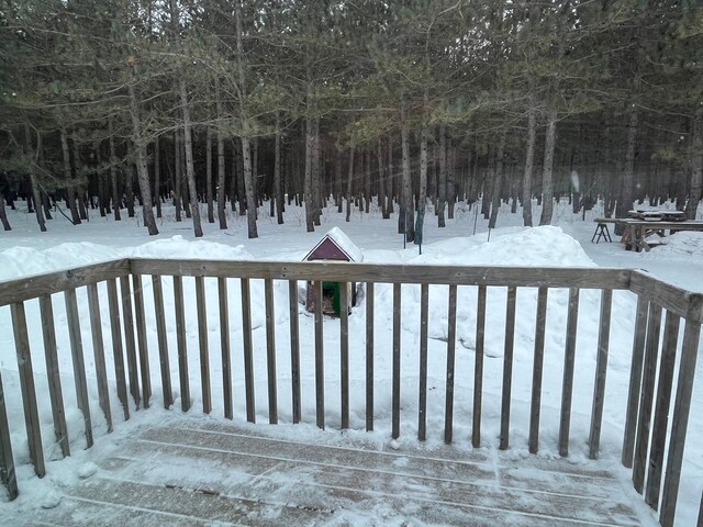 view of snow covered deck