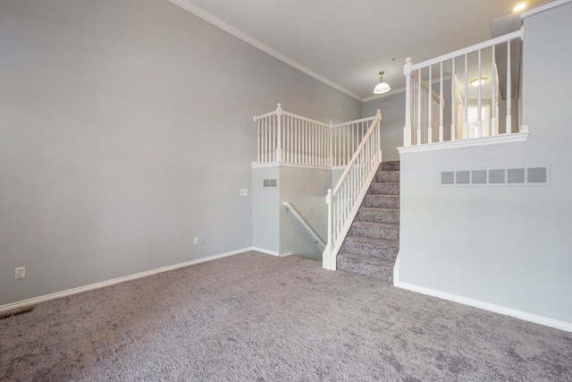 unfurnished living room with carpet floors and ornamental molding