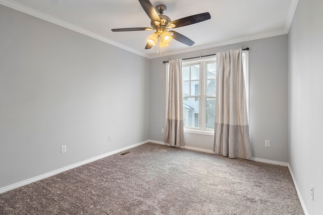 empty room with ornamental molding, carpet floors, and ceiling fan