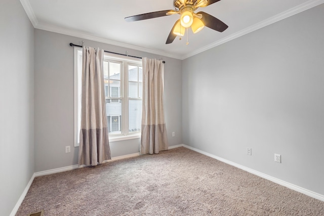 unfurnished room with ceiling fan, crown molding, and carpet