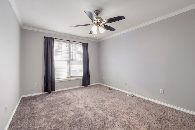 carpeted spare room with ornamental molding and ceiling fan