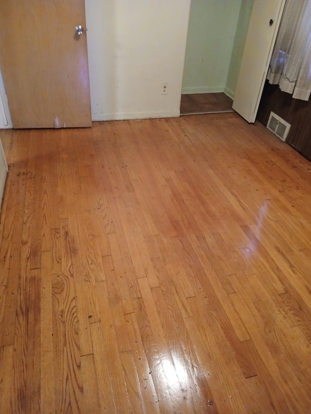 spare room featuring light wood-type flooring