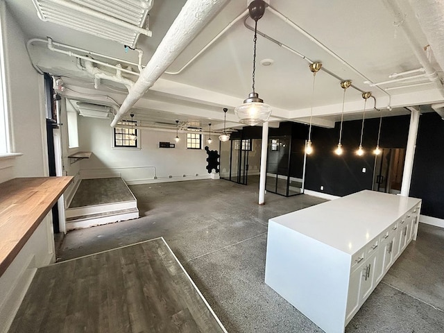 interior space featuring an outdoor kitchen and ceiling fan